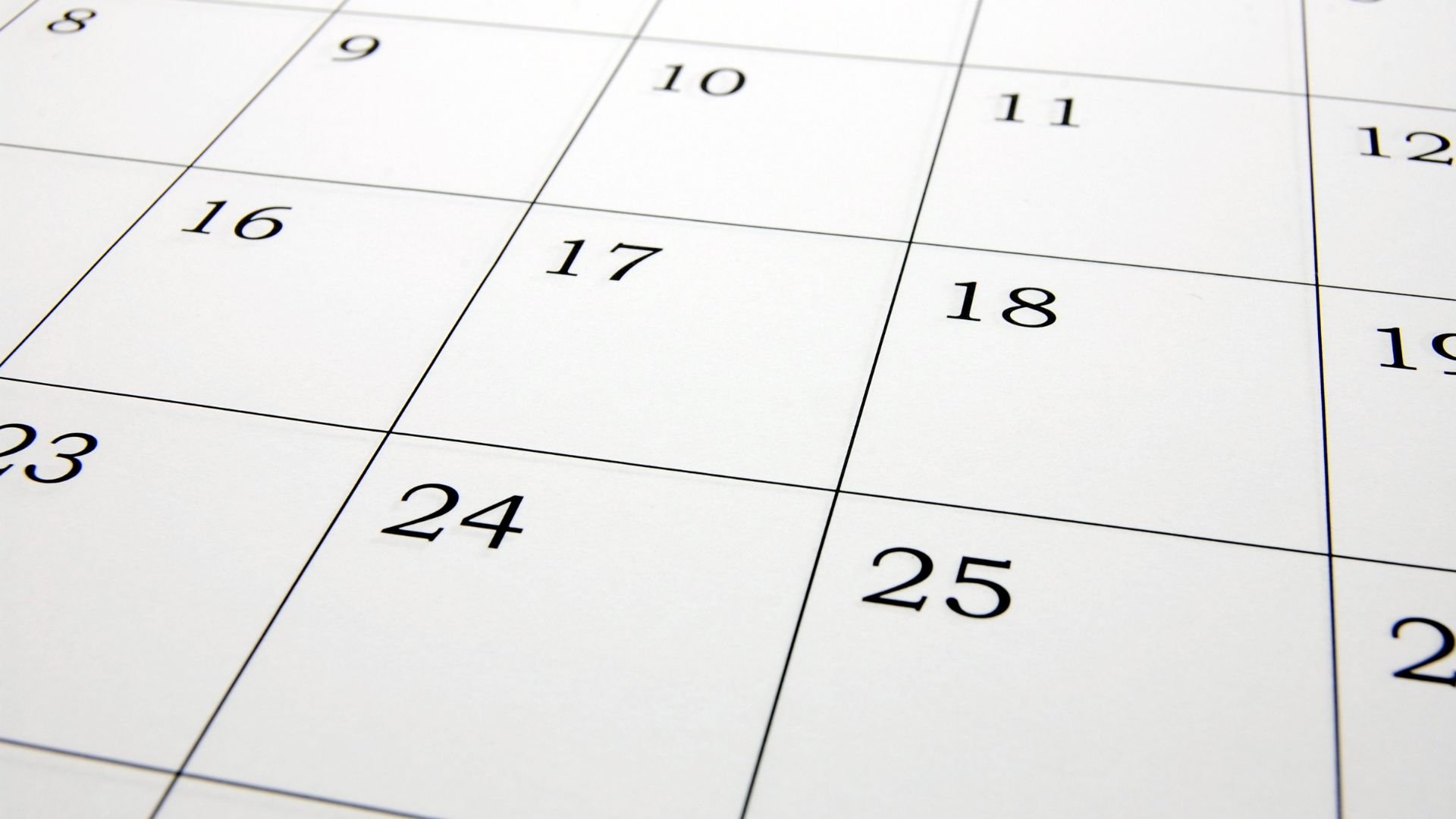 Close-up of a monthly calendar showing numbered dates and grid